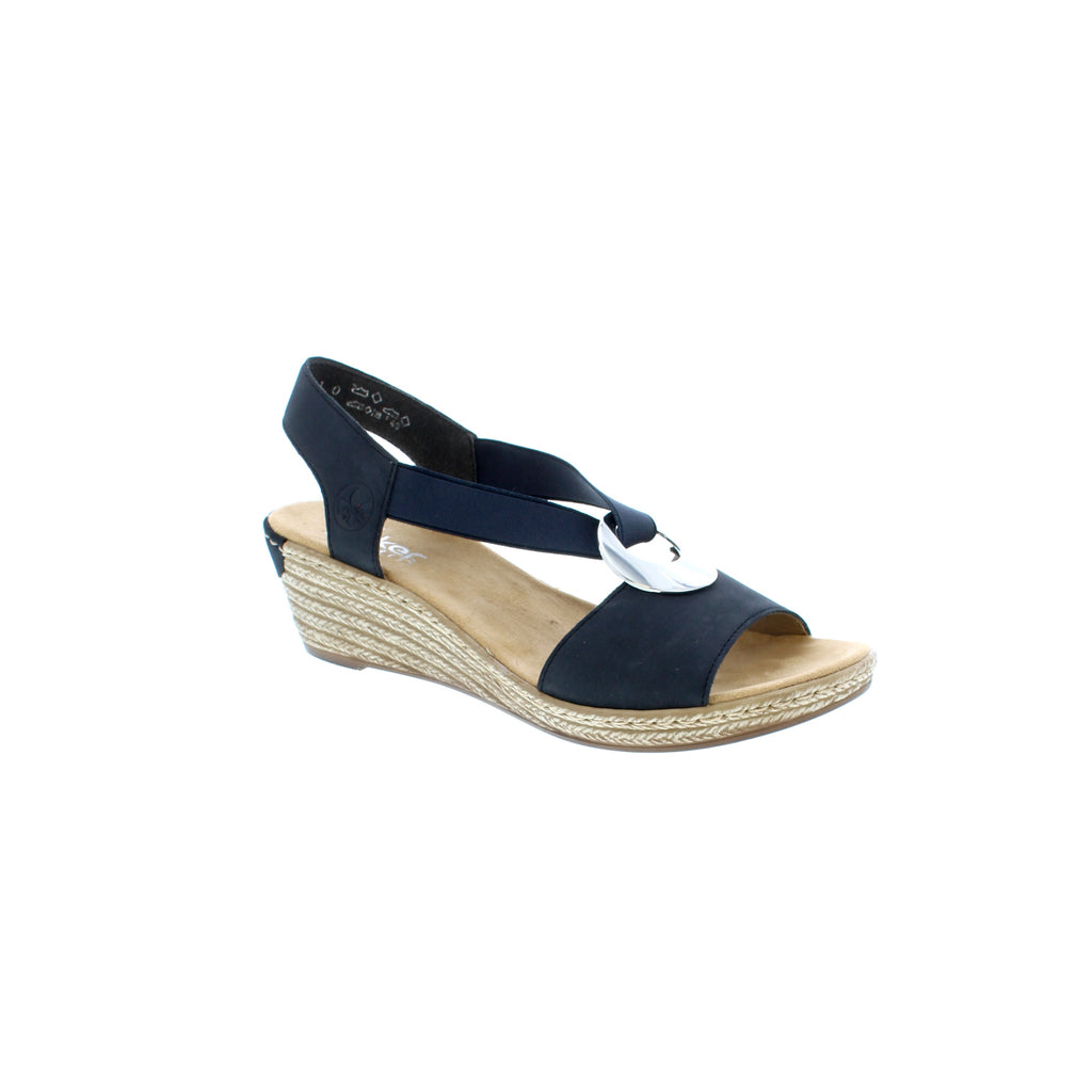 This open-toe wedge sandal from Rieker features two elasticated straps that weave through a silver disc for easy on/off. The silver disc provides an elegant decorative accent. Designed with a lightly cushioned insole for all-day comfort and a durable, flexible, lightweight rubber outsole that delivers shock-absorbing traction. 