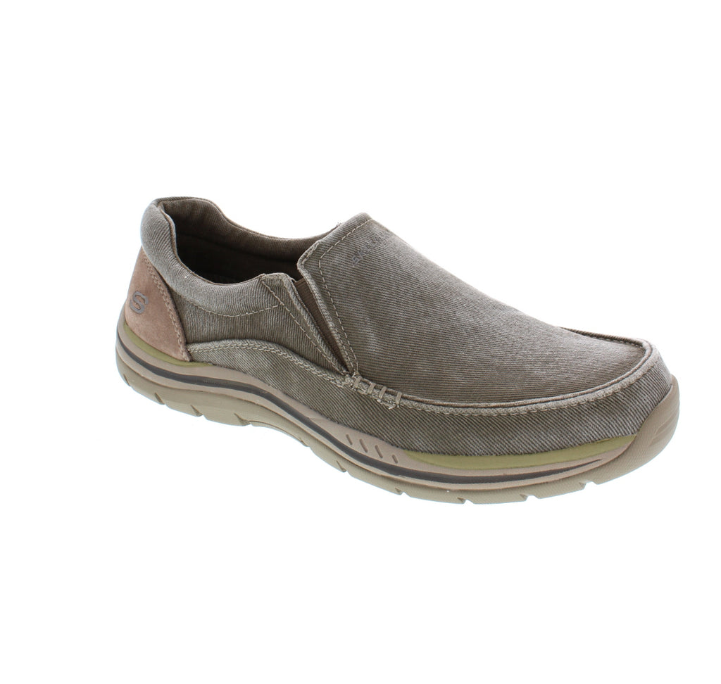 The Expected Avillo slip on, by Skechers, brings comfort to every step! Slip-on this shoe for an out-of-the-box, worn-in look that you’ll fall in love with!
