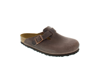 The signature slip-on clog from Birkenstock. The Boston is crafted from high-quality oiled leather with an anatomically contoured 100% sustainable cork footbed. This classic and comfortable design has an adjustable strap across the vamp with buckle closure.