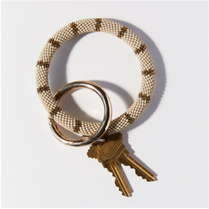 Always know where your keys are with this functional and fashionable keyring from Ink+Alloy. This beaded key ring is crafted with glass seed beads for a stunning design. 