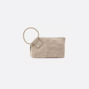 The Sable clutch is designed with a circular handle for a fun, functional way to store your belongings fashionably.