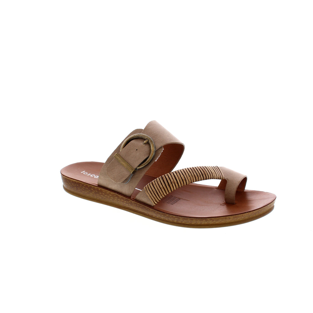 Los Cabos Bria slip-on sandal has a woven bamboo toe strap, while an antique round buckle on the back strap adds a treasure box accent. The A graffiato detailed upper adds the perfect amount of design. 