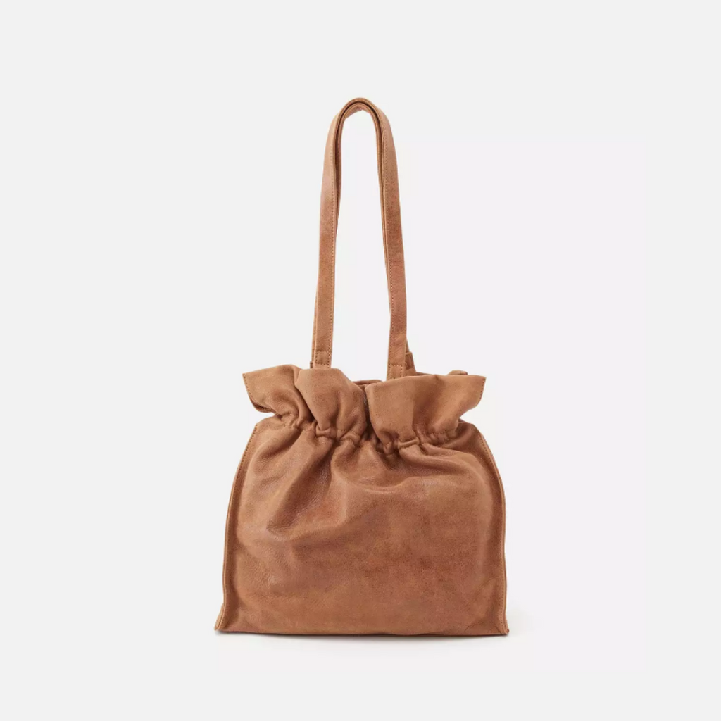 The Caliber bag features a ruched top, spacious interior, super soft leather with a gently buffed surface to offer a timeless design with enough space to hold all of your essentials.