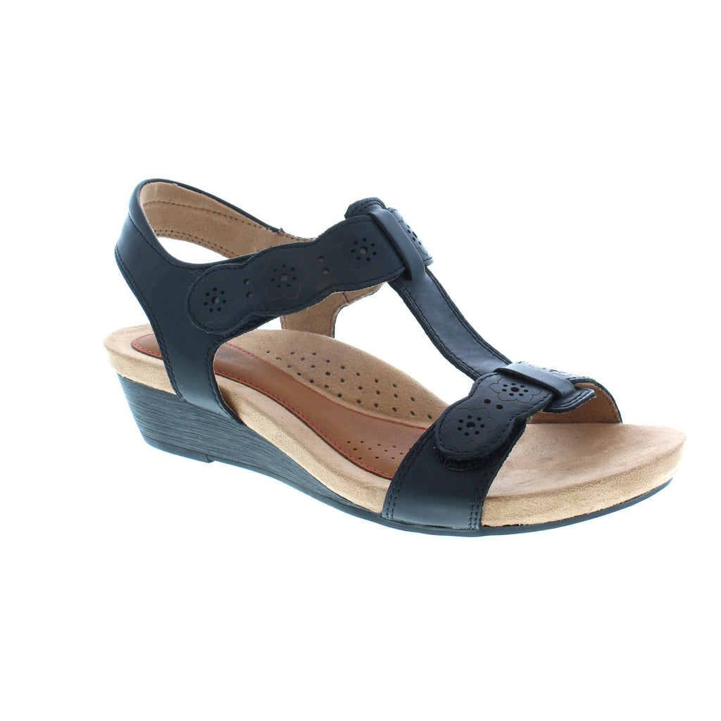 Bring a little Hollywood to your wardrobe! Designed with a supportive anatomic footbed, durable traction outsole, wood grain textured wedge and a beautiful floral design, this Cobb Hill sandal is the perfect balance of glitzand comfort!
