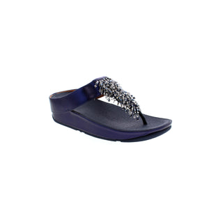 The FitFlop Rumba Beaded sandal features slim uppers adorned with a swishy, shiny fringe of multi-tonal 'crystal' beads for a chic, festive look. Experience all-day comfort and cushioning with the legendary Microwobbleboard™ midsoles. Enjoy enhanced style and comfort in soft, metallic faux-leather.