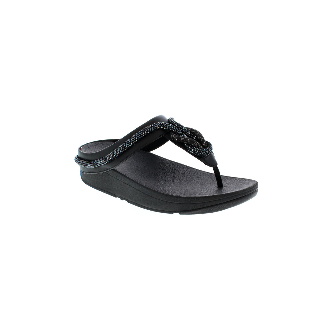 Experience superior comfort with FitFlop's Fino Crystal-Cord sandal. Crafted with premium leather for softness and breathability, these sandals feature a rocker-bottom sole for shock absorption, light arch support for superior comfort, and a 1-2" flatform for added height. Enjoy this season's hottest look in black.