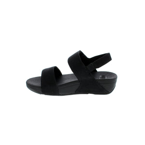 The FitFlop Lulu Adjustable Shimmerlux sandal is designed for comfort and style. Crafted with leather upper, round toe, and light arch support, these sandals are shock absorbent and have both a velcro and halter strap closure. With an elevated rocker bottom and flatform heel, they're perfect for casual everyday wear.