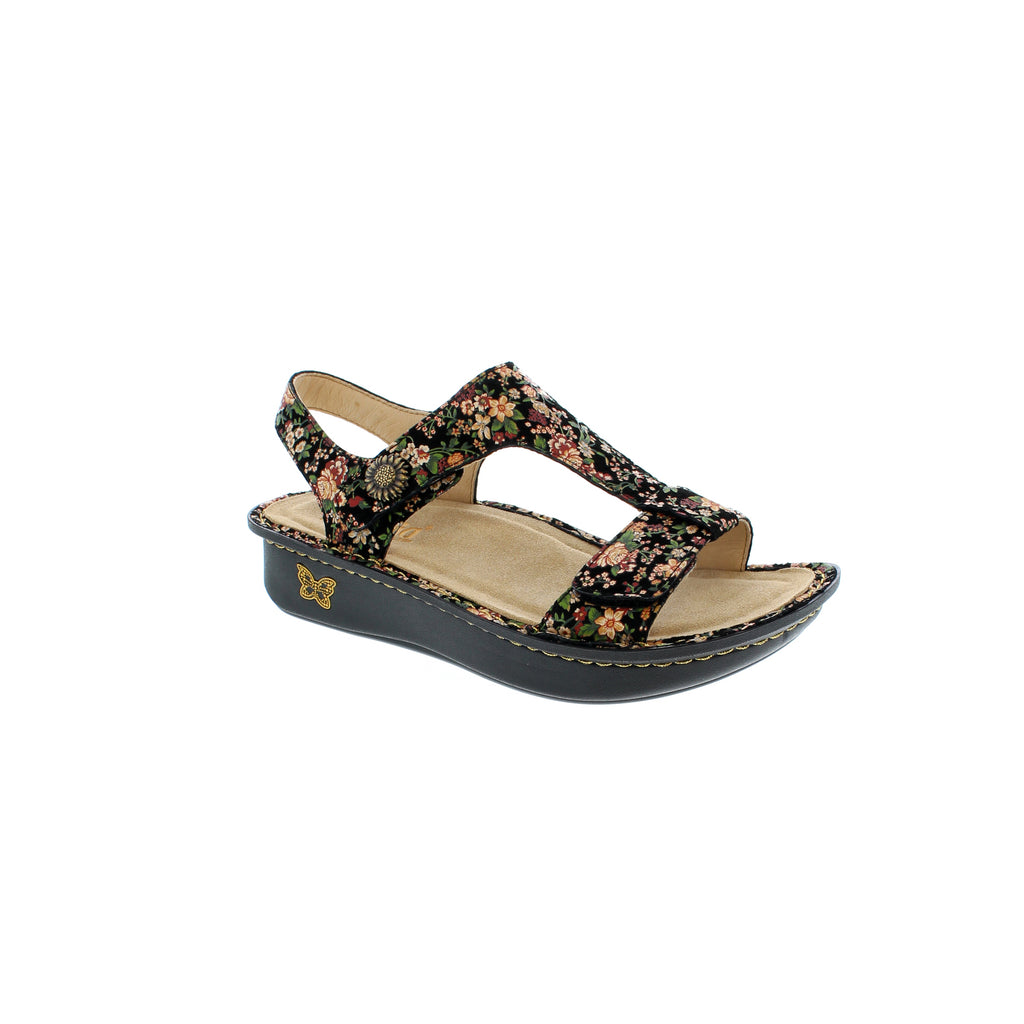 Kerri slingback sandal features an adjustable hook-and-loop closure to give you a custom fit, comfort contoured footbed for an ergonomic fit and classic rocker outsole support with a gentle rocking motion. 