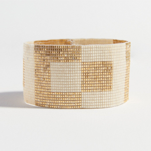 The Square Stretch Bracelet is handcrafted with delicate glass beads with an elegant shimmer and is handwoven for an effortlessly cool beaded bracelet.  