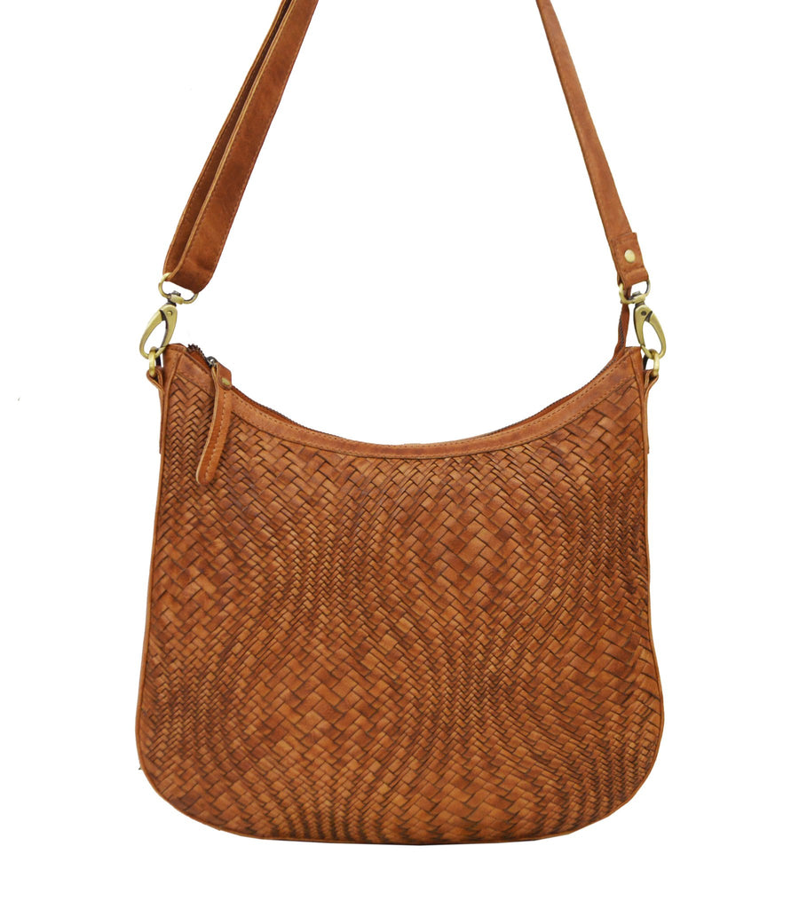 Fit all of your "must-haves" into this handcrafted, woven leather bag by Milo! Featuring an adjustable strap, zippered compartments and cell phone pocket - this is the perfect grab-and-go bag!