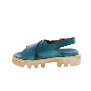 Miz Mooz Pacific platform sandal features a chunky treaded sole, wide leather crisscross straps, and an ankle buckle for the perfect fit in these fashion-forward sandals!