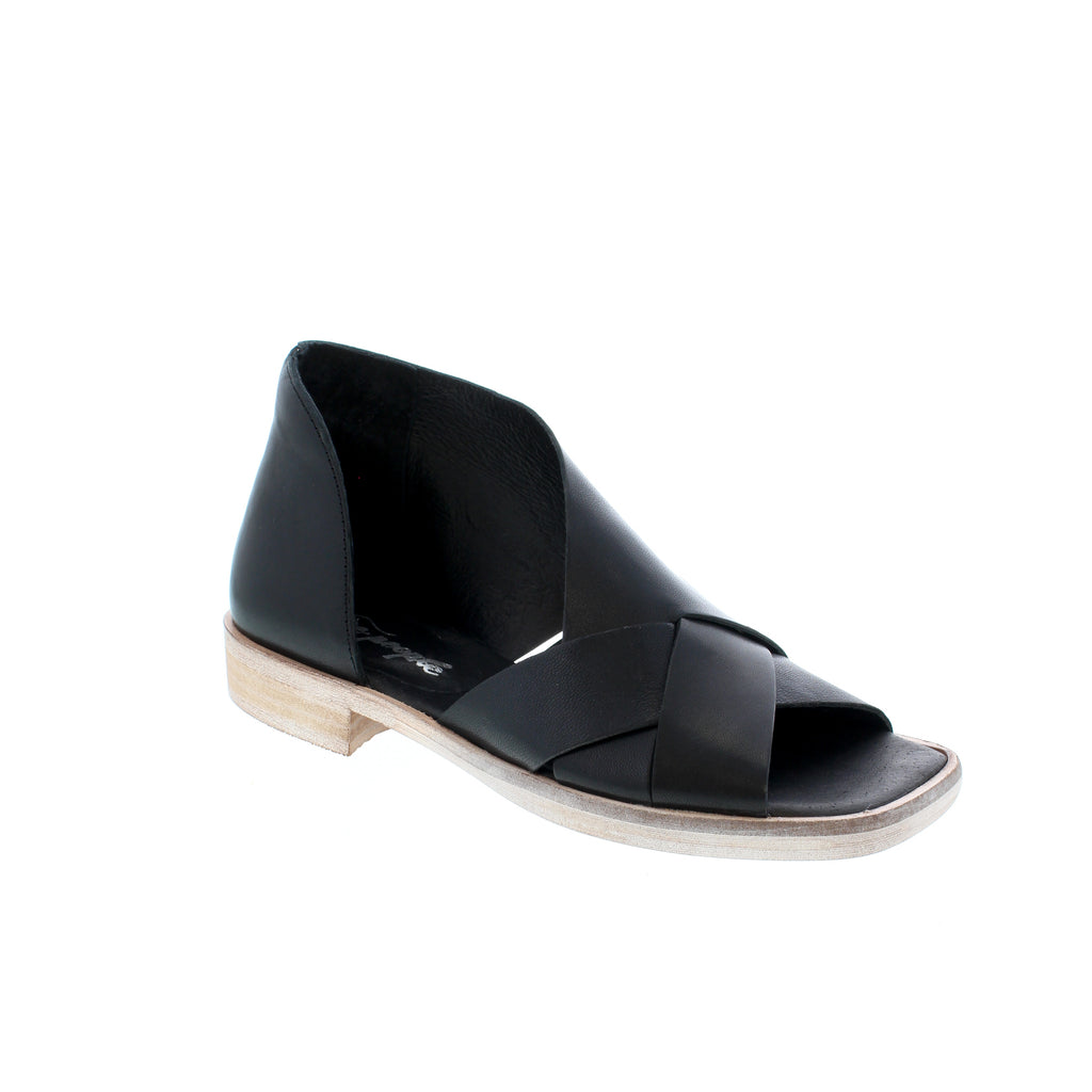 Free People Sun Valley is an open-toe style and soft leather fabrication with crisscross strap detailing side cutouts and a minimal stacked heel.