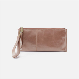 Vida is the perfect grab-and-go clutch with a convenient wrist strap. Offering ample organization and crafted in a vintage hide leather that gets more beautiful over time, you'll want to add this clutch to your collection!