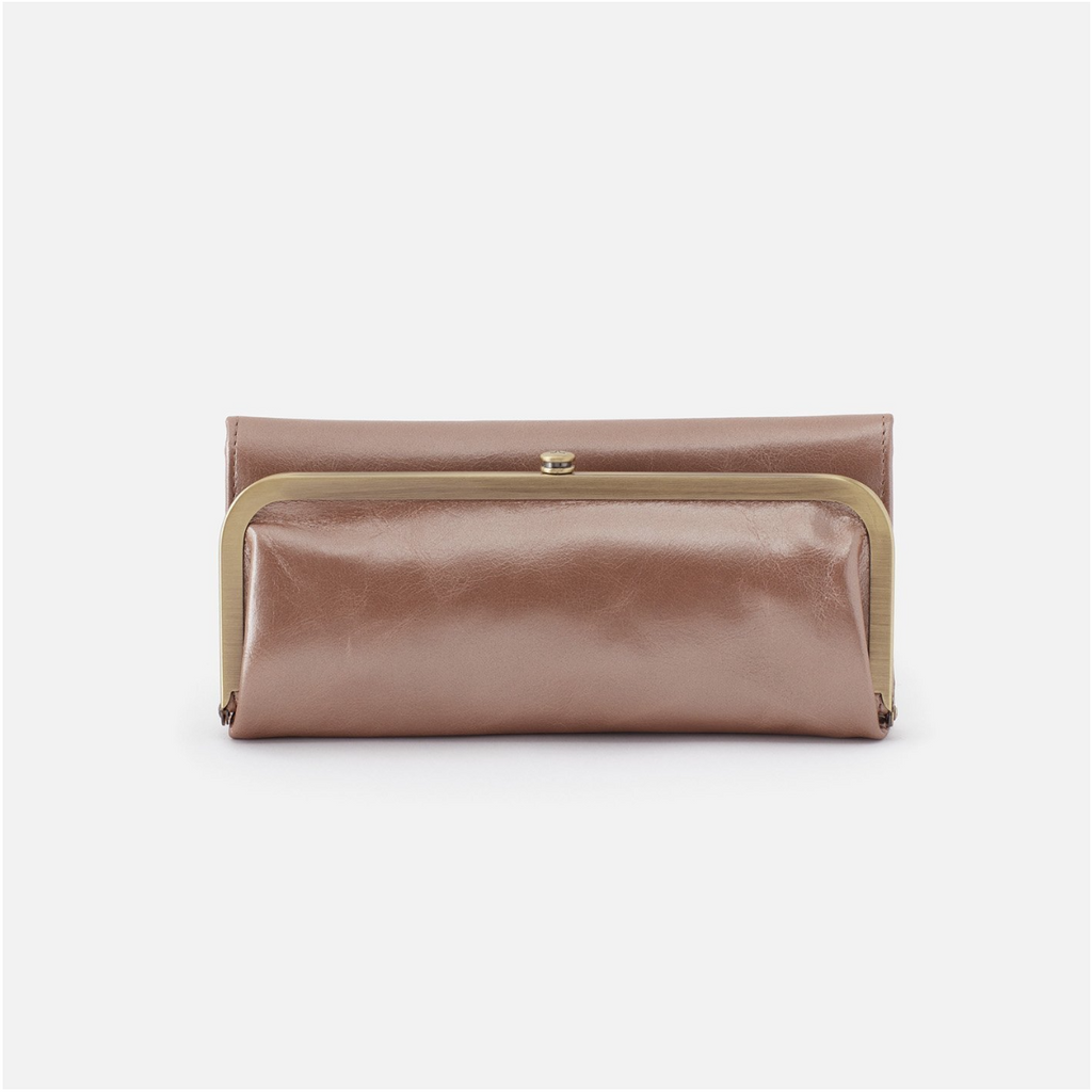 For years to come, Rachel will soon be your most-loved wallet with a timeless frame closure and vintage-inspired design. Crafted in a limited-edition top-grain leather metallic hide and ample storage, this wallet will be on repeat! 