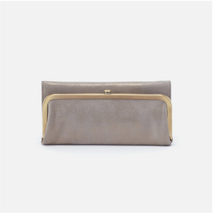 For years to come, Rachel will soon be your most-loved wallet with a timeless frame closure and vintage-inspired design. Crafted in a limited-edition top-grain leather metallic hide and ample storage, this wallet will be on repeat! 