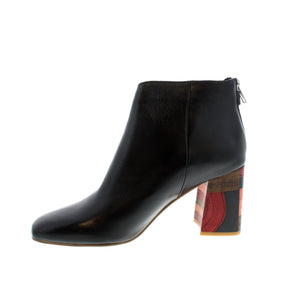 The Yolly hippie-chic bootie is designed with soft, premium leather with a squared toe and asymmetric cut and rear zip fastening secured with a studded tab. A unique wooden block heel with multicoloured accents that vividly evoke 70s discoteque style will become a quick favorite!