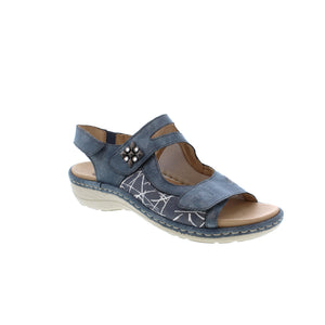 This gorgeous open-toe sandal features three adjustable velcro straps for a customizable fit, with a beautiful print design and a jewelled brooch design, a slight wedge heel, and a shock-absorbent footbed to keep your feet comfortable and supported. 