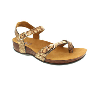 A casual sandal with a leather strap toe-post and unigue adjustable features. The toe post is made of soft supple leather and the back ankle strap has extra padding, preventing rubbing or biting. Fine leather straps and a hand-polished wood effect give this sandal a unique style.